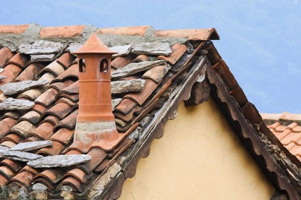 Italy, Varenna Terra cotta roof and chimney